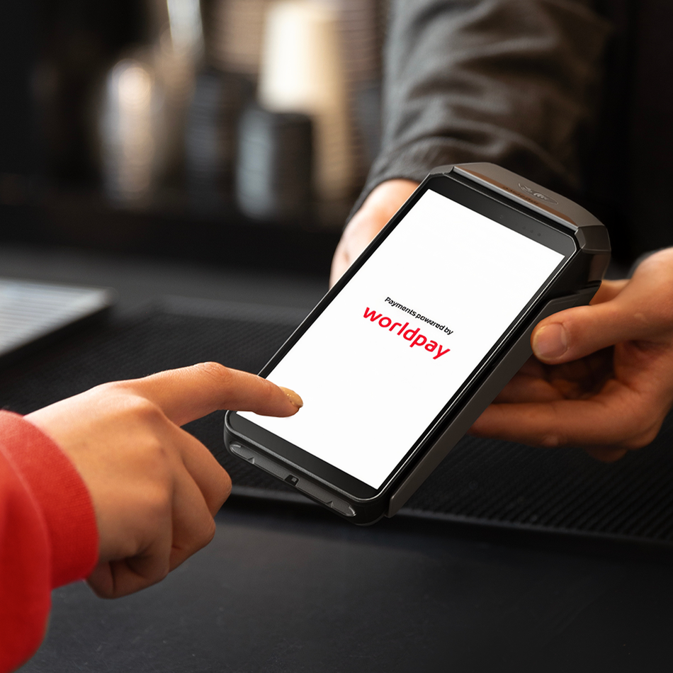 card swipe on a terminal sitting on a counter